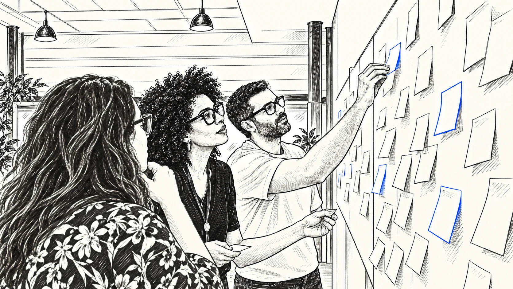 Colleagues mapping ideas together on a wall